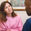 Dr Mohan speaking with a patient during an aesthetic consultation in West Wimbledon